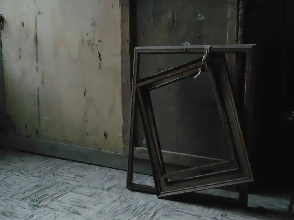 A stripped down wooden furniture frame before restoration