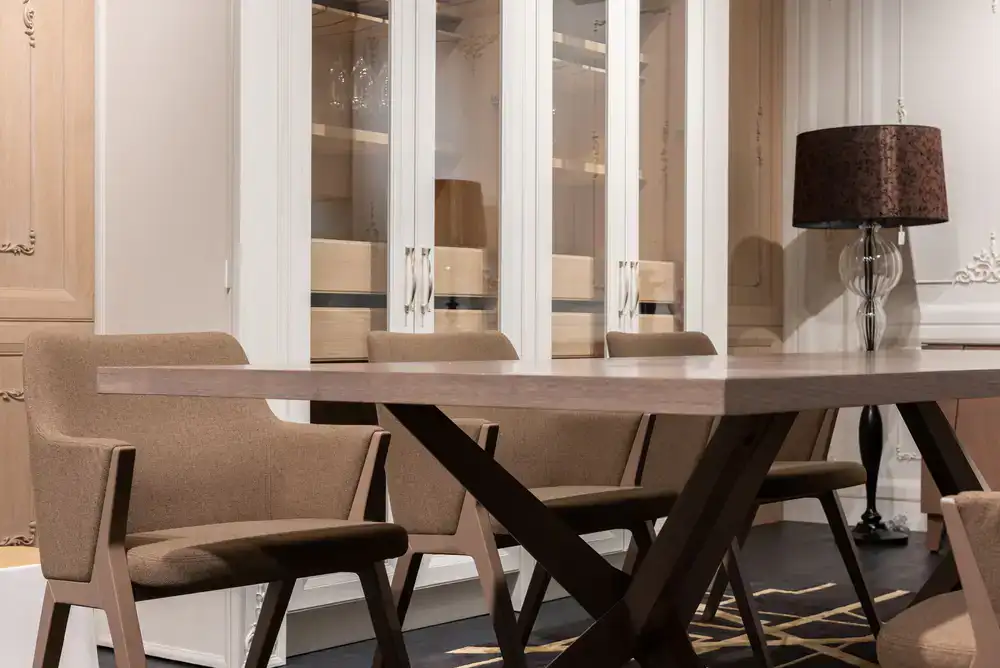 A set of elegant dining chairs finished in cream damask fabric